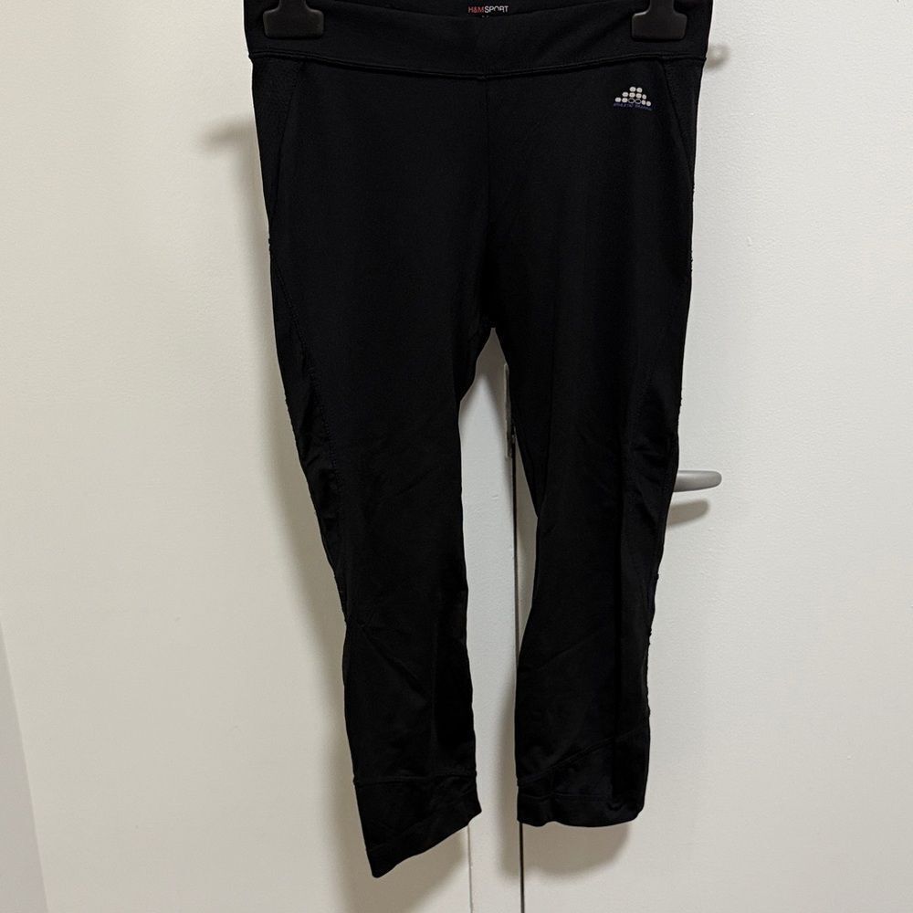 H & M Sport Black Leggings with ankle zipper. Size small.